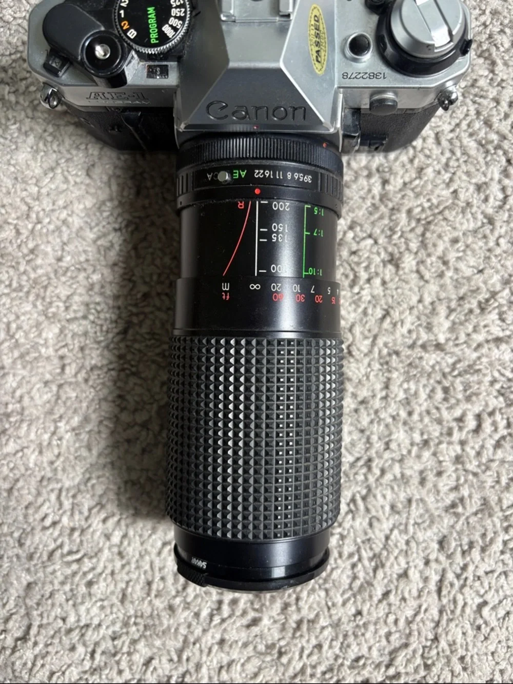 Canon JAPAN AE-1 35mm SLR Film Camera + Sakar Zoom Lens Bundle – Untested